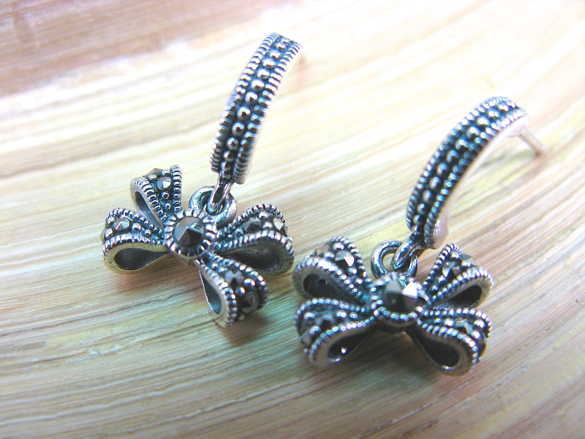 Ribbon Marcasite Dangle Earrings in 925 Sterling Silver